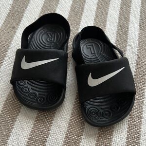 Nike Black Sandals with Iconic Swoosh Design